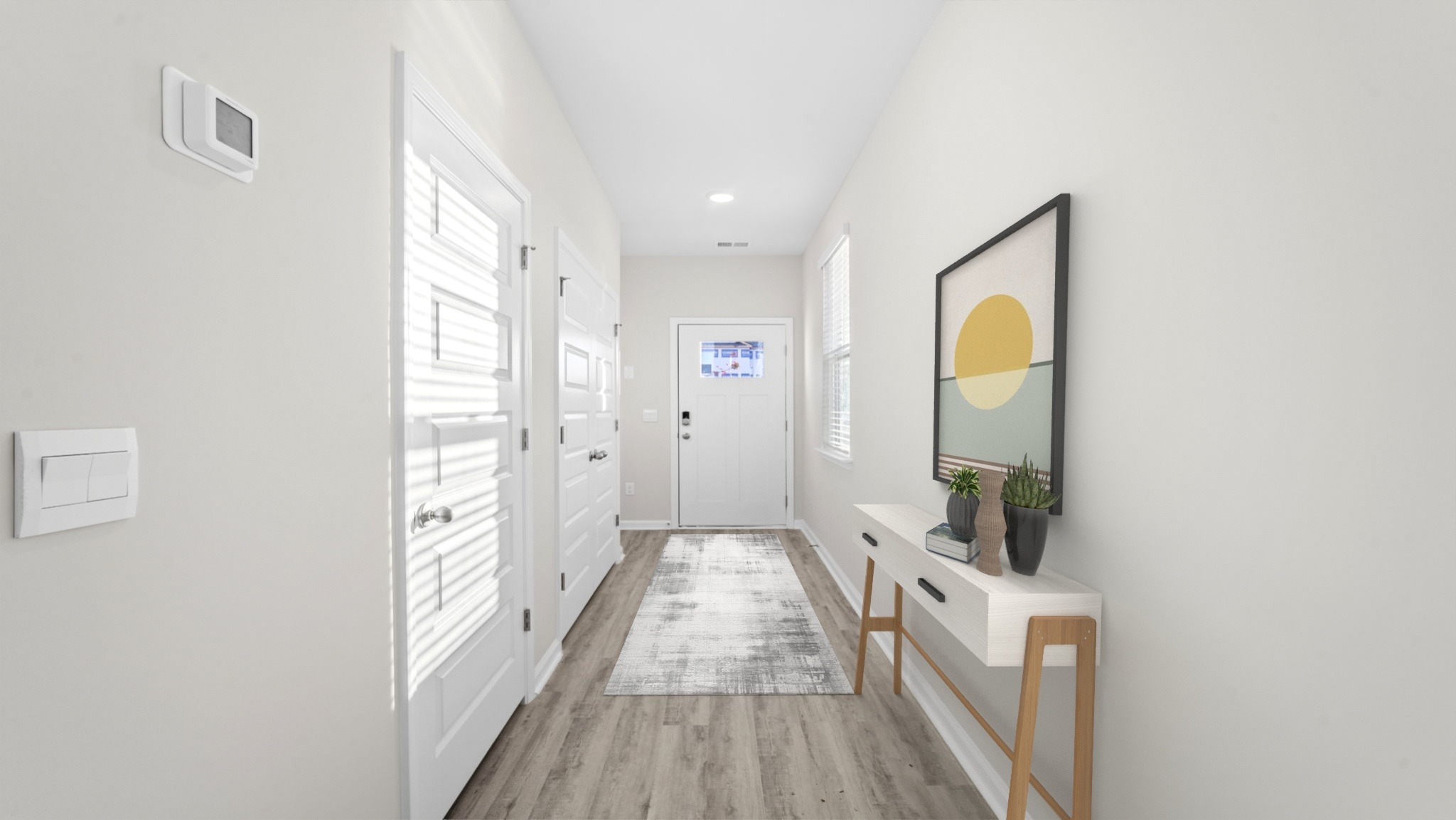 Front door foyer with natural light from hall window