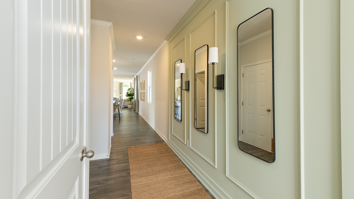 Front door entryway leading down the long entry hall
