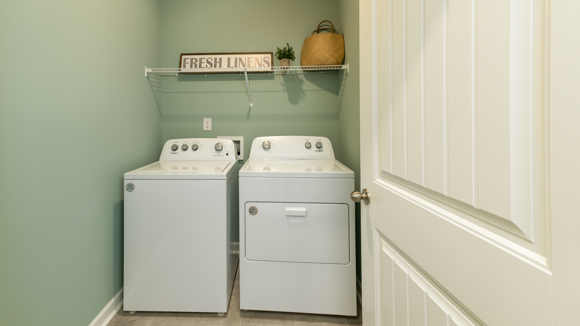 Laundry room with ventilated shelving