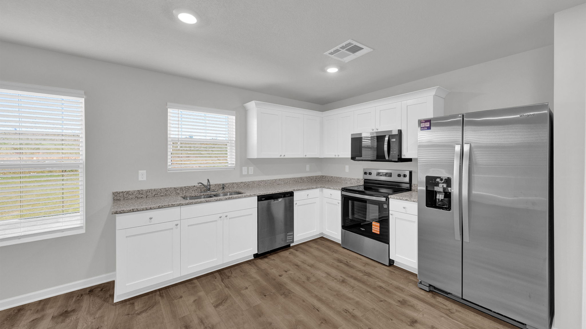 Kitchen area with a window over the kitchen sink