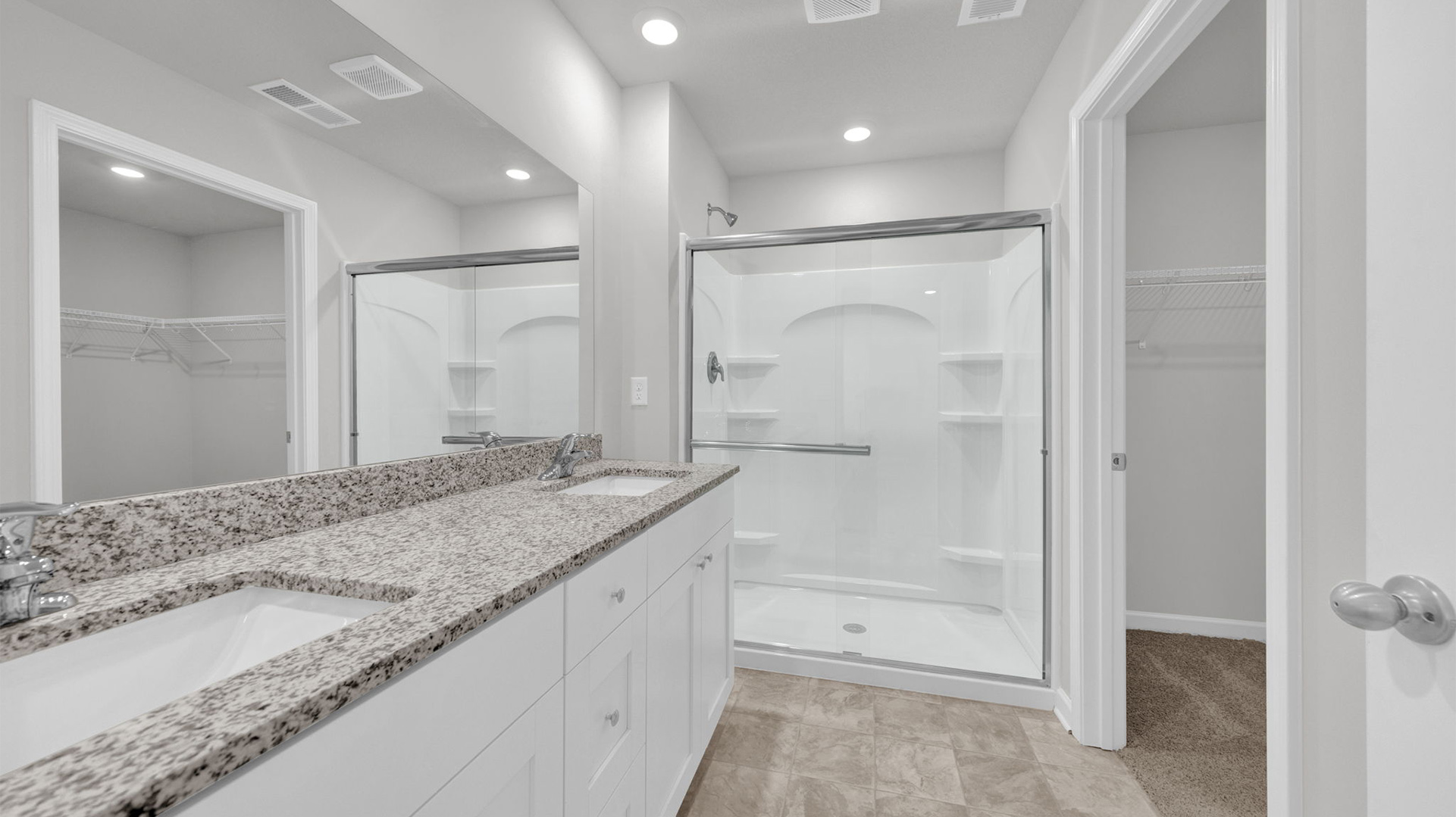 Granite countertops on dual vanity in primary