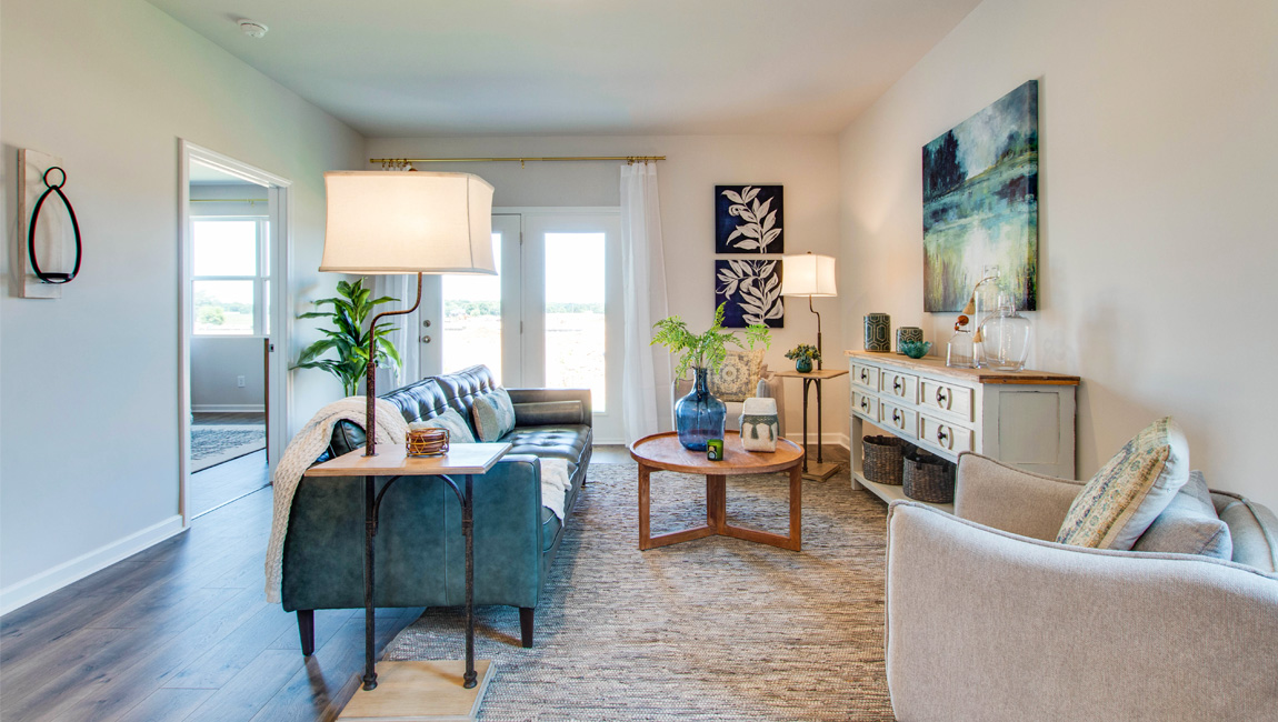 Spacious living room opens up after the kitchen