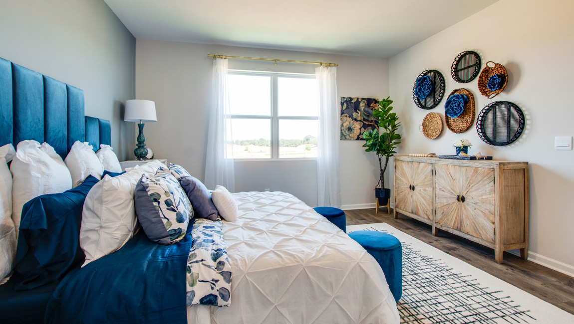 Primary bedroom with a large double window for natural light