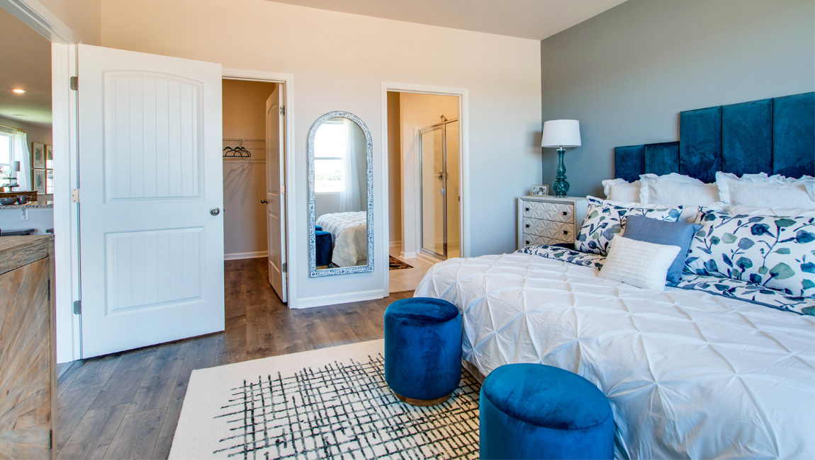 Primary bedroom comfortably fits a king size bed