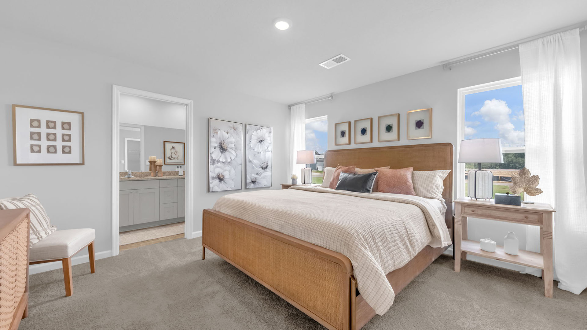 Primary bedroom with two tall windows for natural light