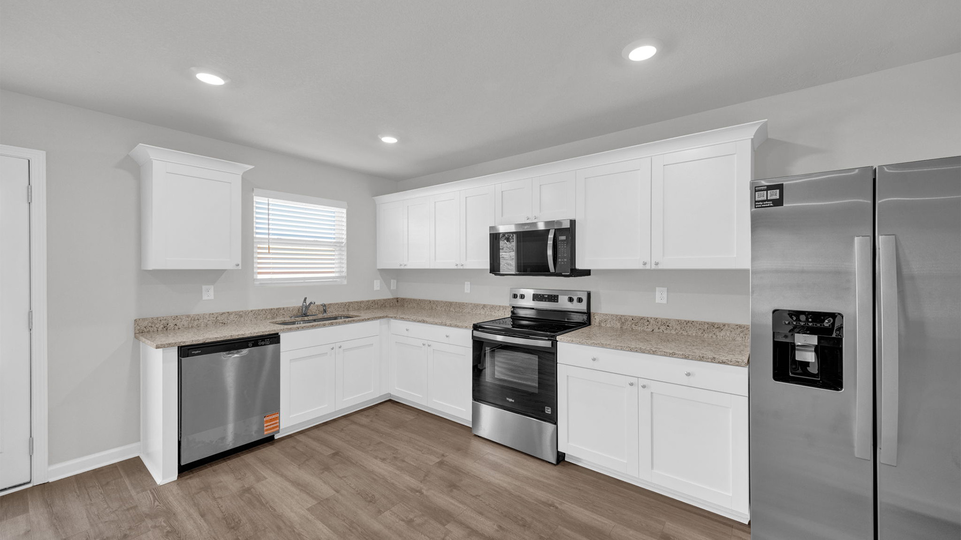 Beautiful kitchen area with light cabinets