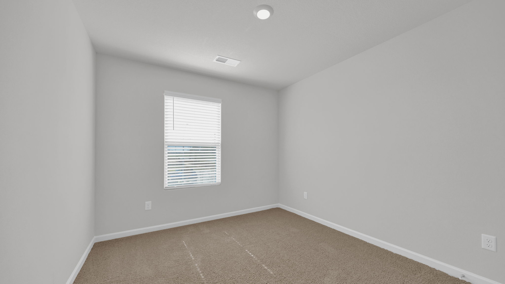 Third bedroom on the second floor with a single window for natural light