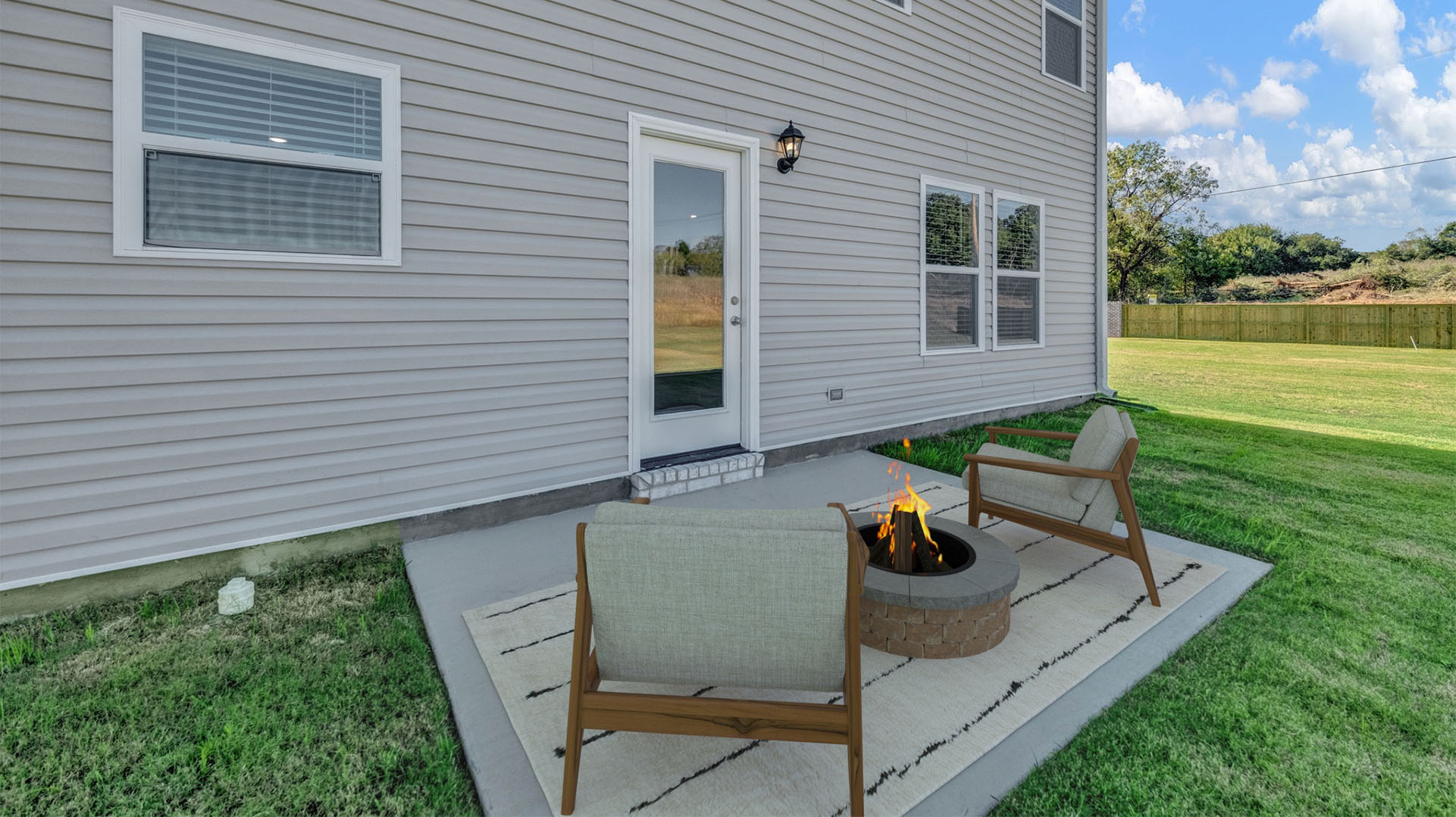 Back patio virtually staged with furniture perfect for entertaining