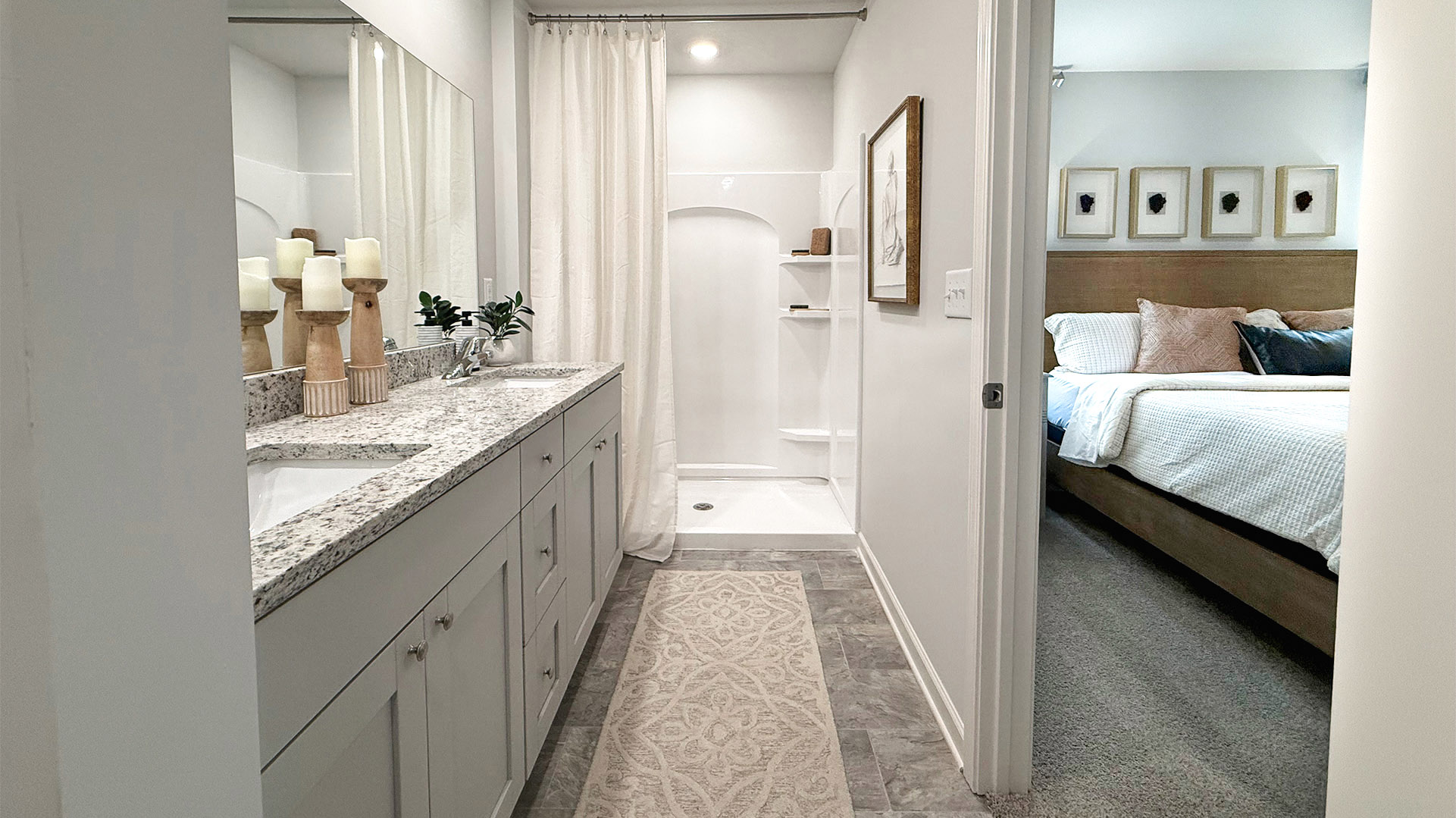 Primary en suite bathroom with beautiful tile flooring