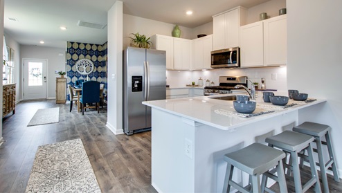 Open view of entryway leading into kitchen