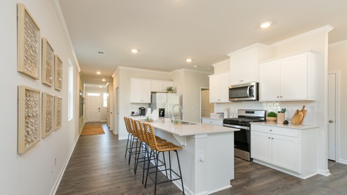 Beautiful spacious kitchen that opens up at the end of long entry hall