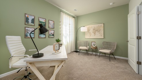 Second bedroom with neutral walls and carpet flooring