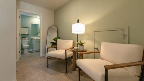 Entrance to third bedroom featuring a seating area