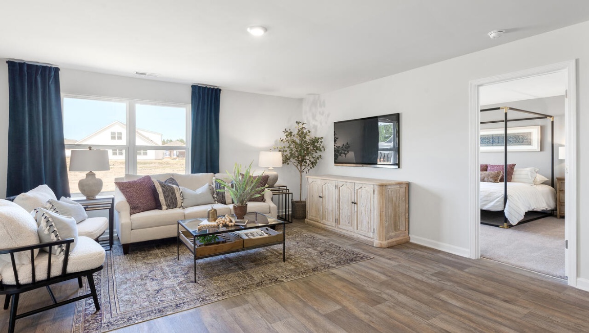 Living room with close access to primary suite