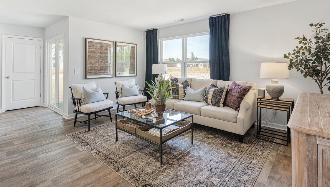 Beautiful living room with a double window overlooking backyard