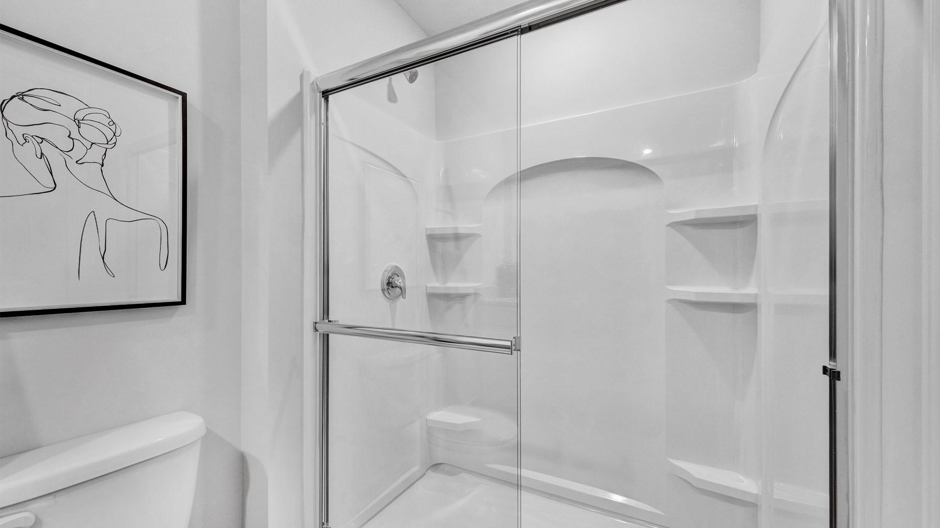 En suite primary bathroom with a walk in shower