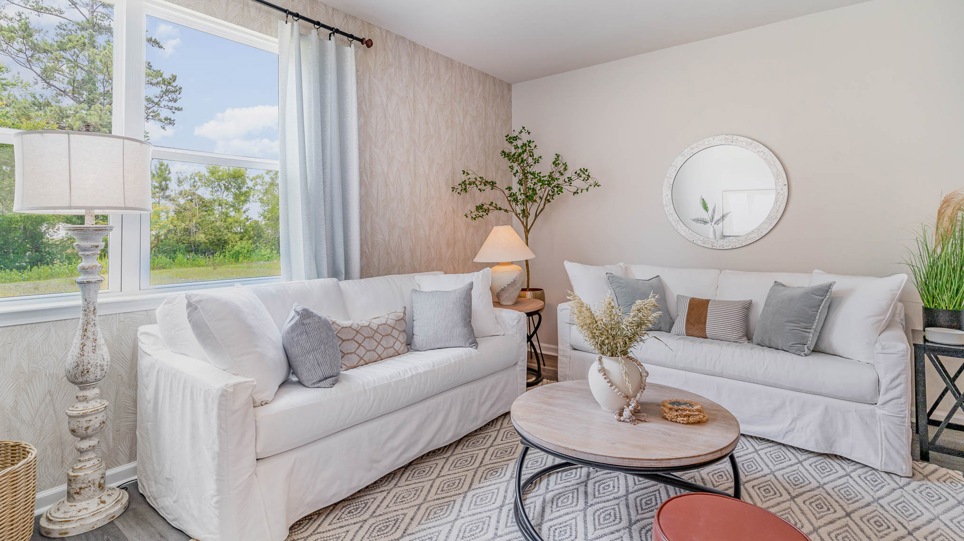 living room with light neutral interior walls and revwood laminate flooring