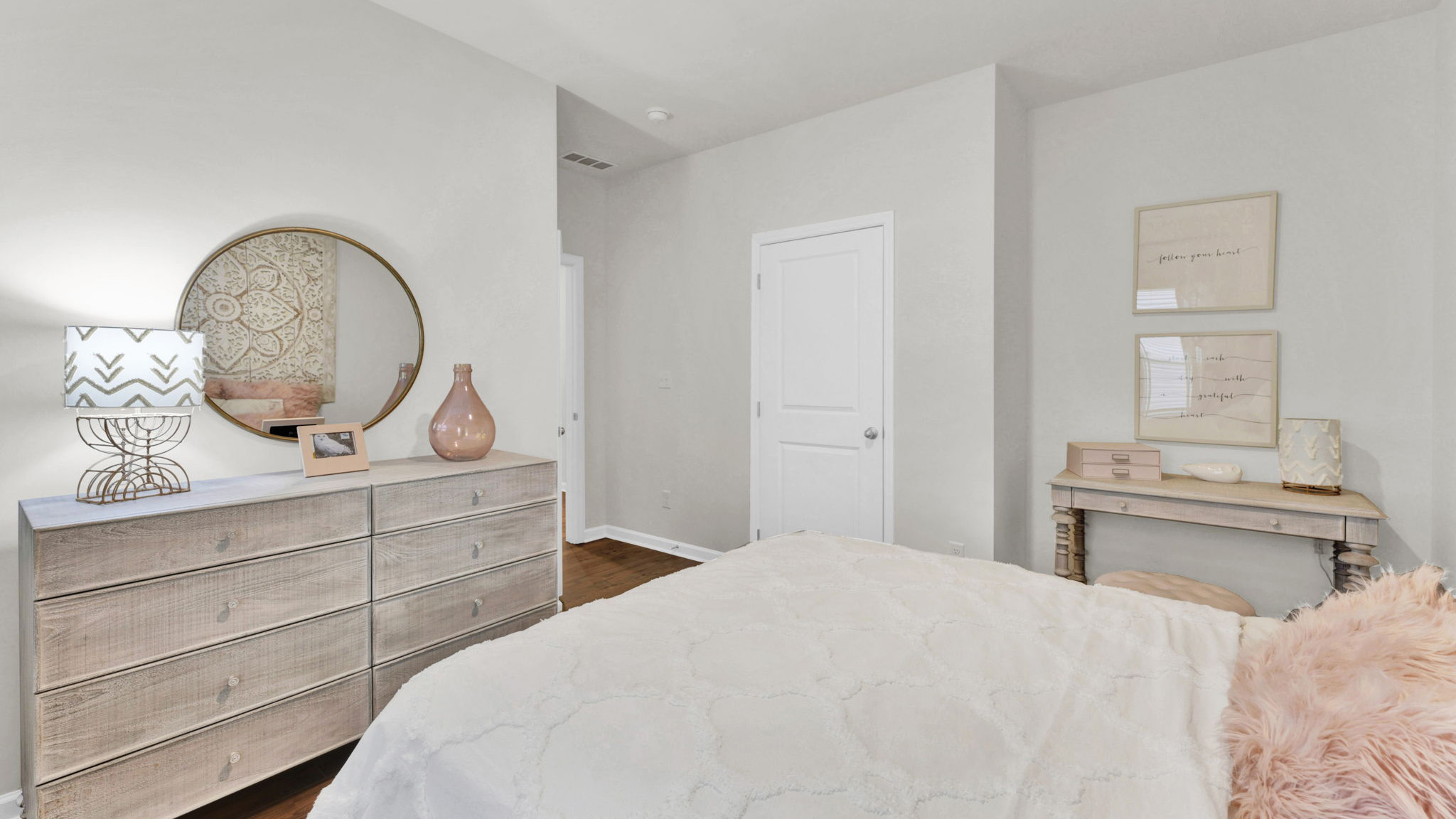 bedroom with single window and walk-in closet