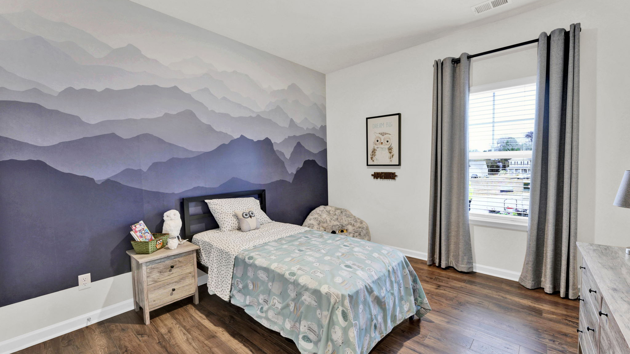 bedroom with single window and walk-in closet