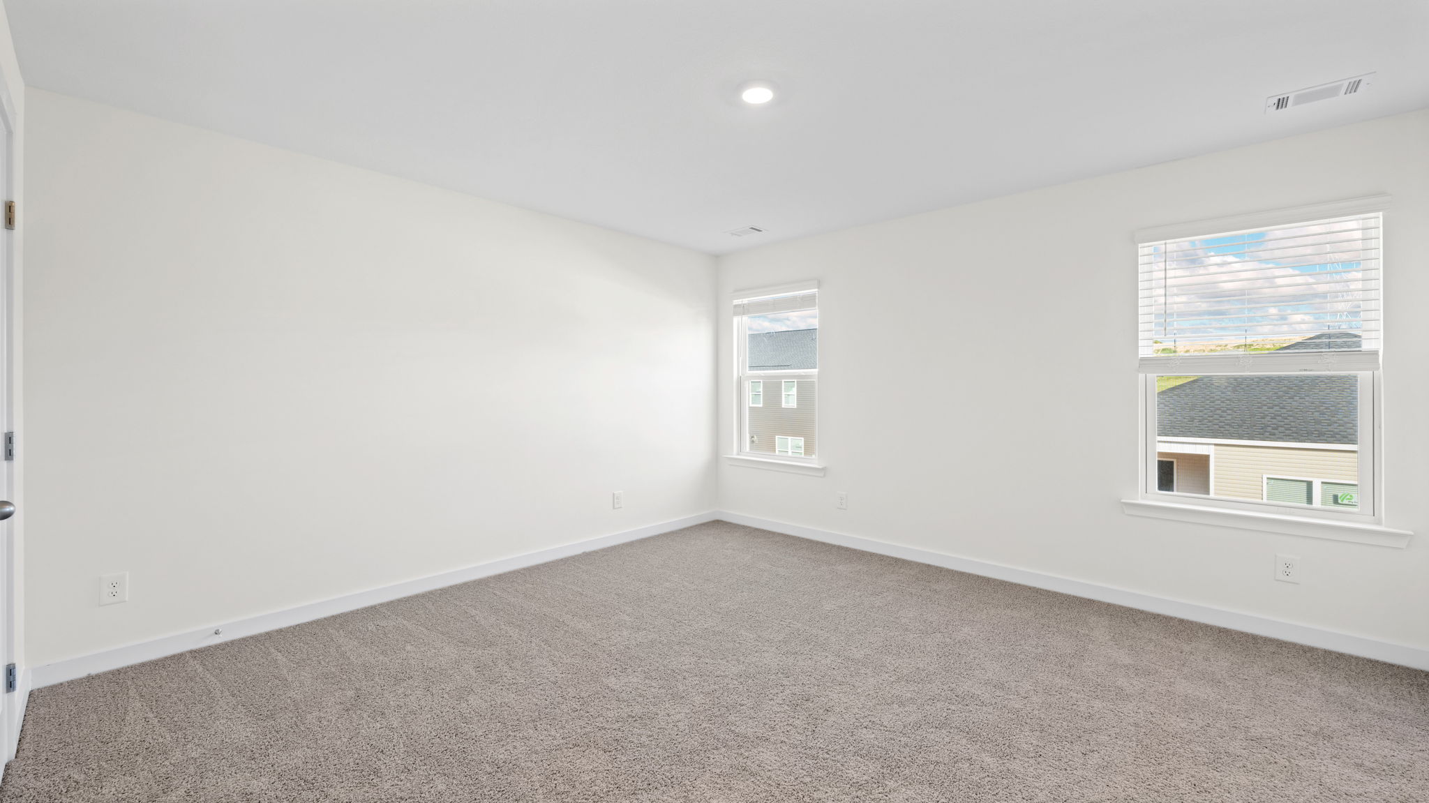 bedroom with two single windows and en suite