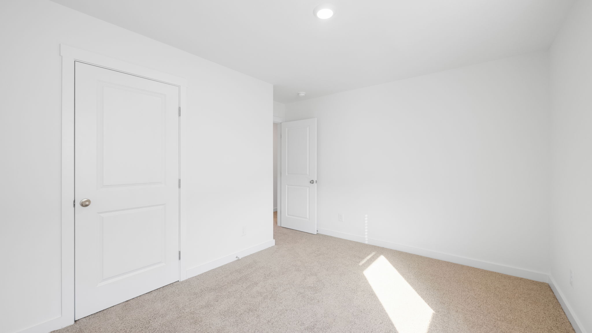 bedroom with single window and walk-in closet