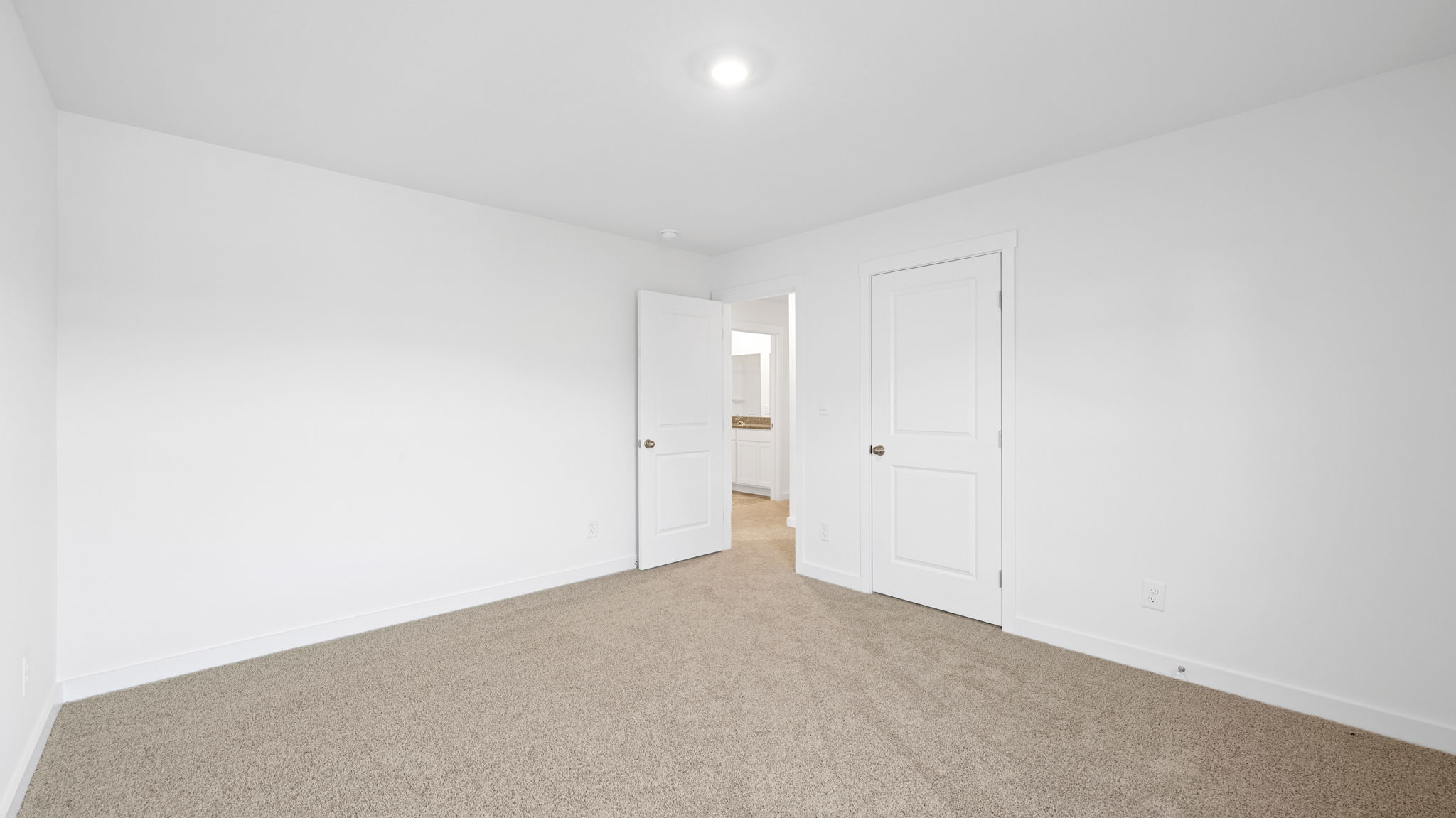 bedroom with single window and walk-in closet