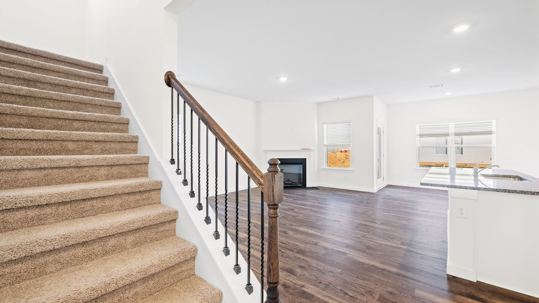 open concept living with stairs to the left