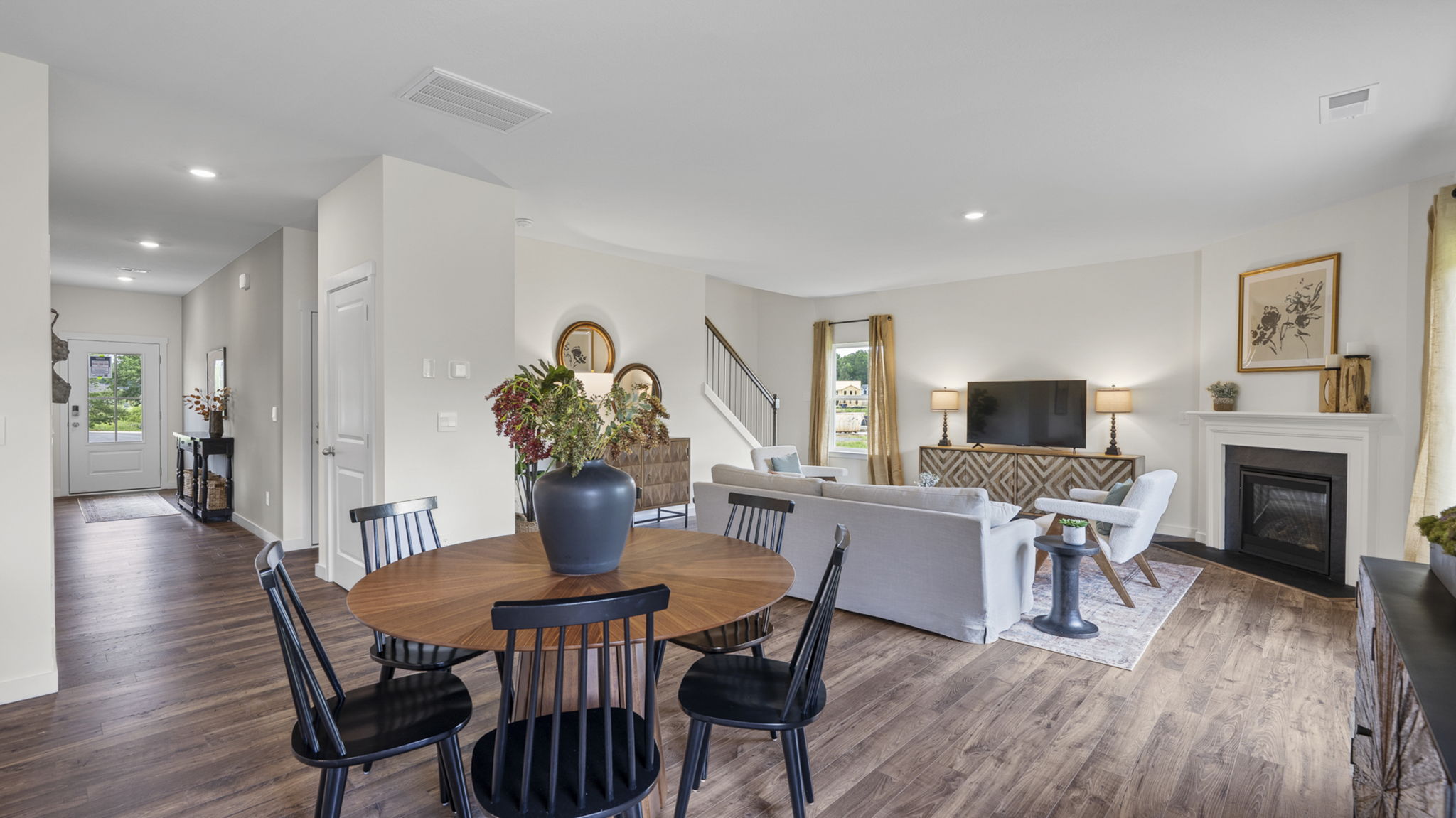 open concept dining area with back patio door
