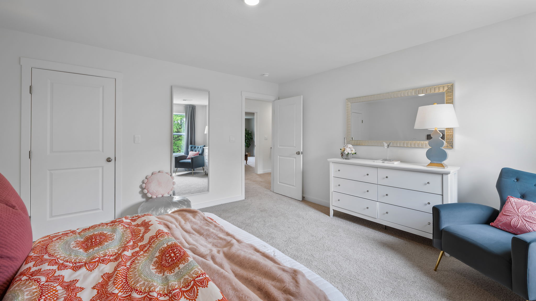 bedroom with single window and walk-in closet
