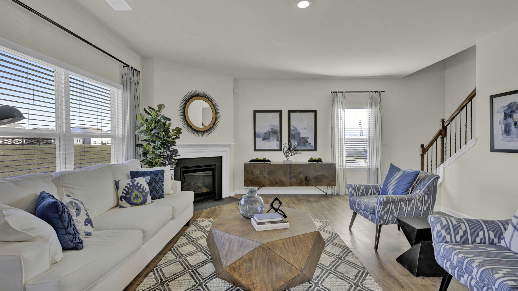 open concept living room with double and single window