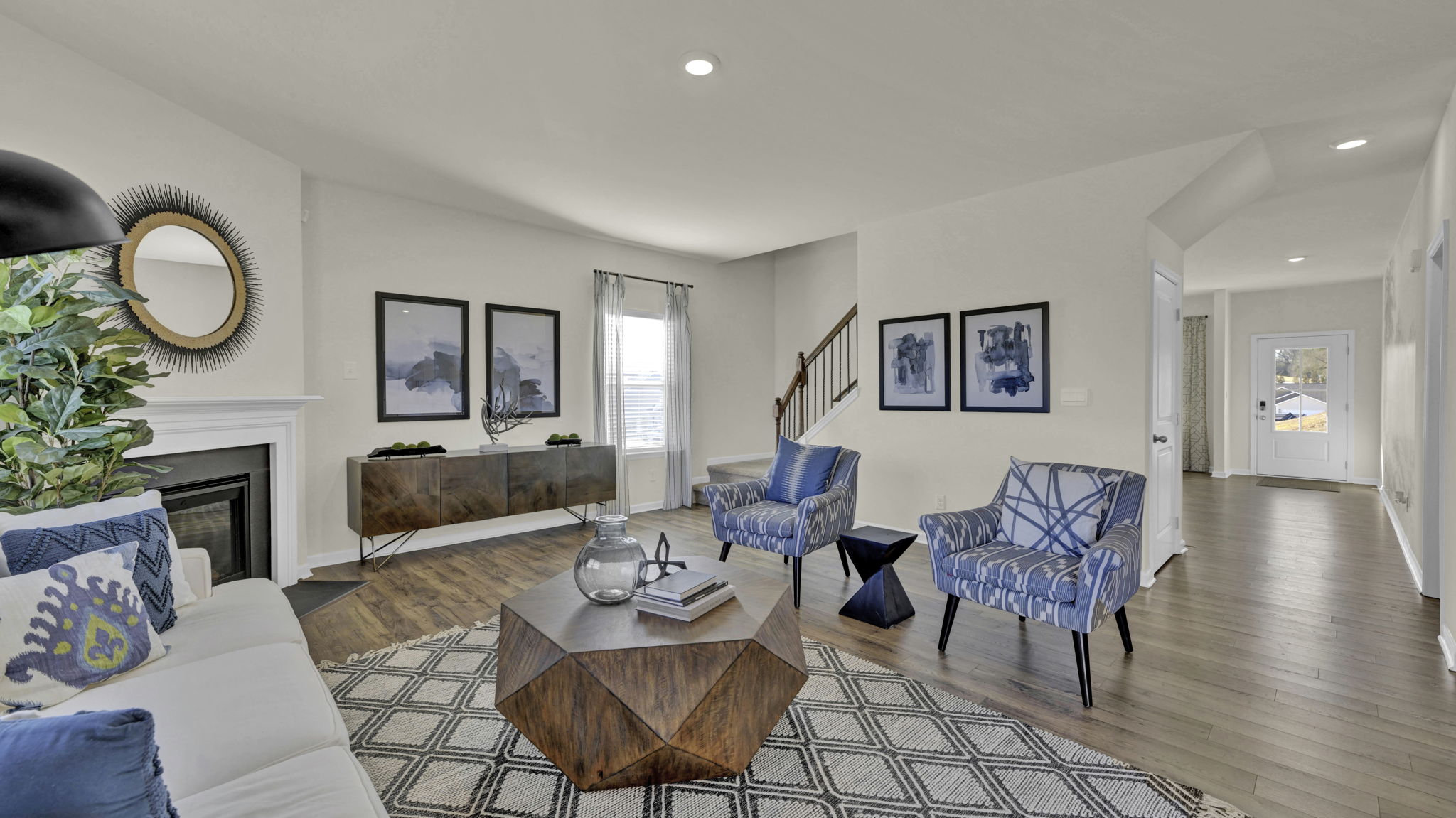 open concept living room with double and single window