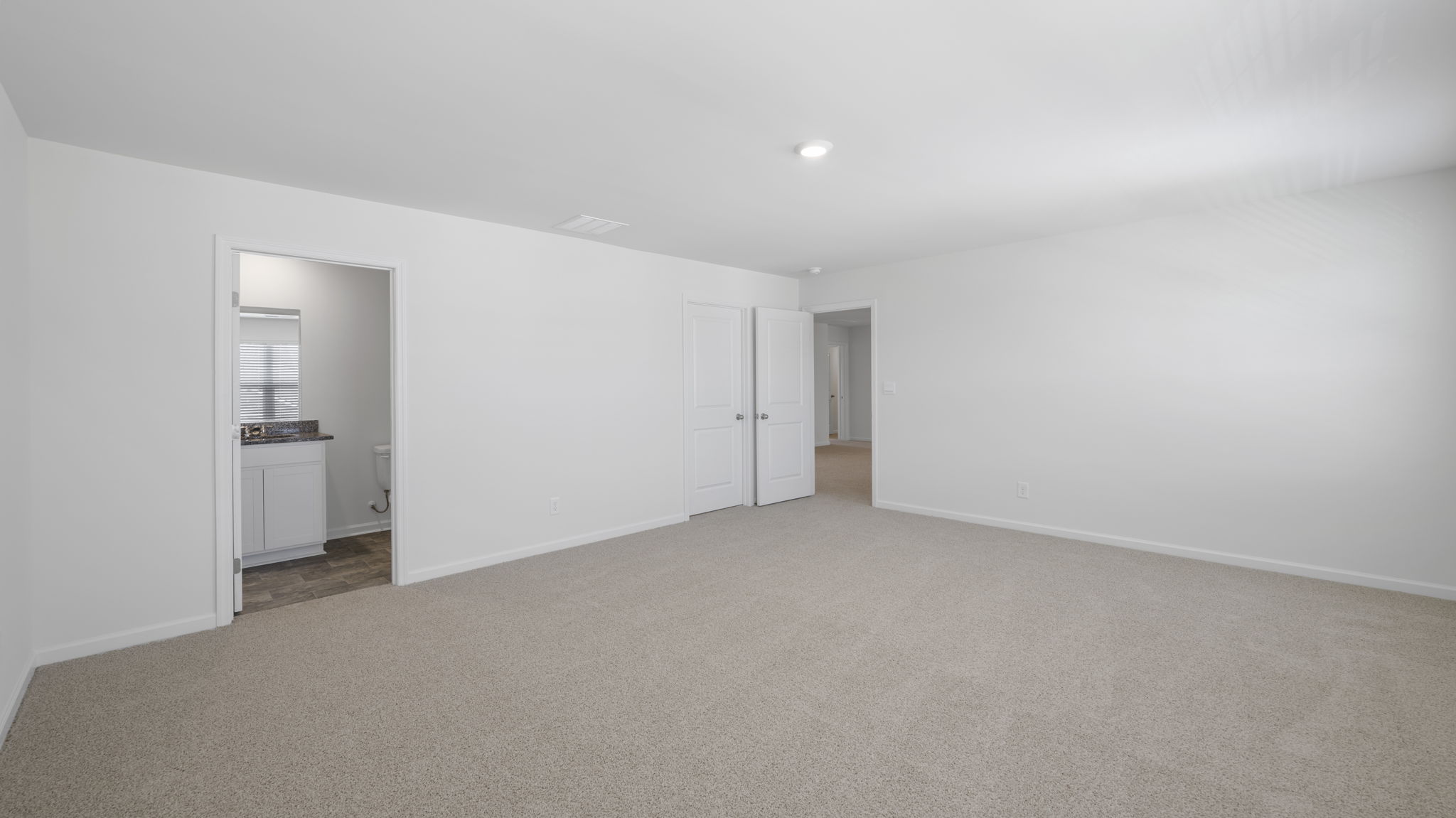 bedroom with two double windows and en suite