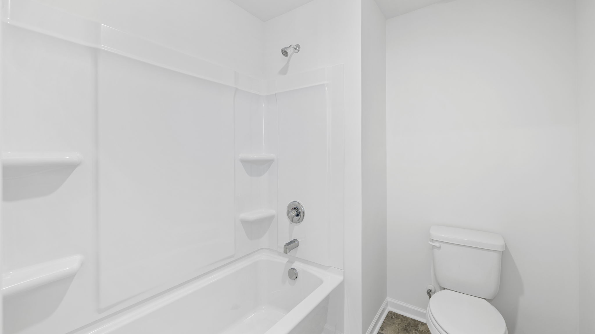 bathroom with double vanity and shower/ tub duo