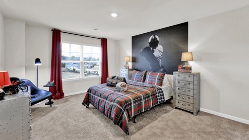 Teenagers bedroom decorated in a sports theme