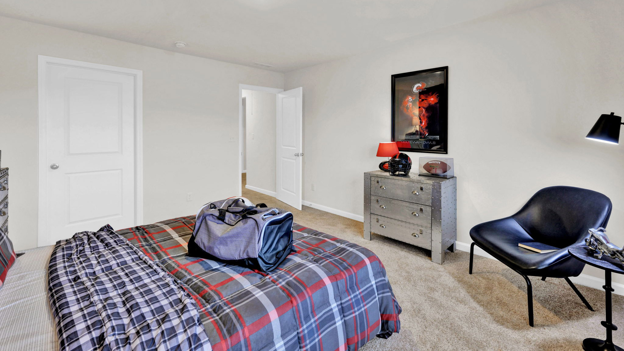 bedroom with bed chair and dresser
