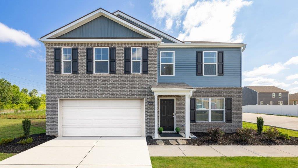 exterior of two story home with brick