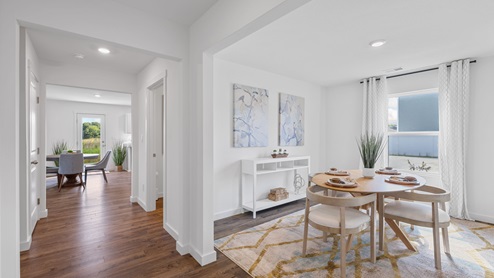 Dining room off entry way of home with single window