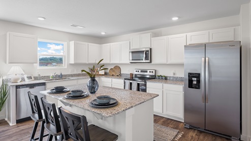Kitchen with large island and bar seating