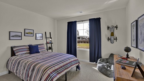 Guest bedroom with large windows