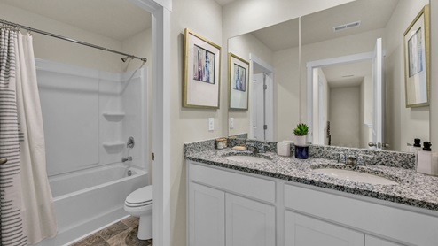 Secondary bathroom with a double vanity