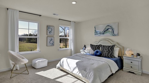 Guest bedroom with large windows