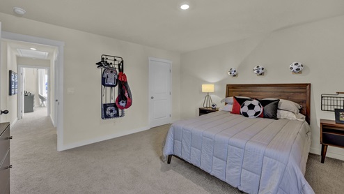 Secondary view of a kids bedroom decorated in a sporty theme