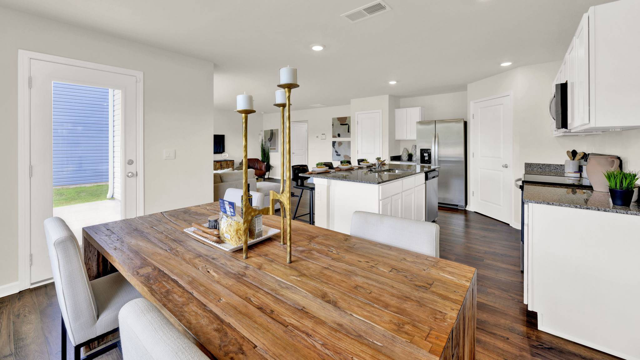 dining table with chairs and view of the kitchen