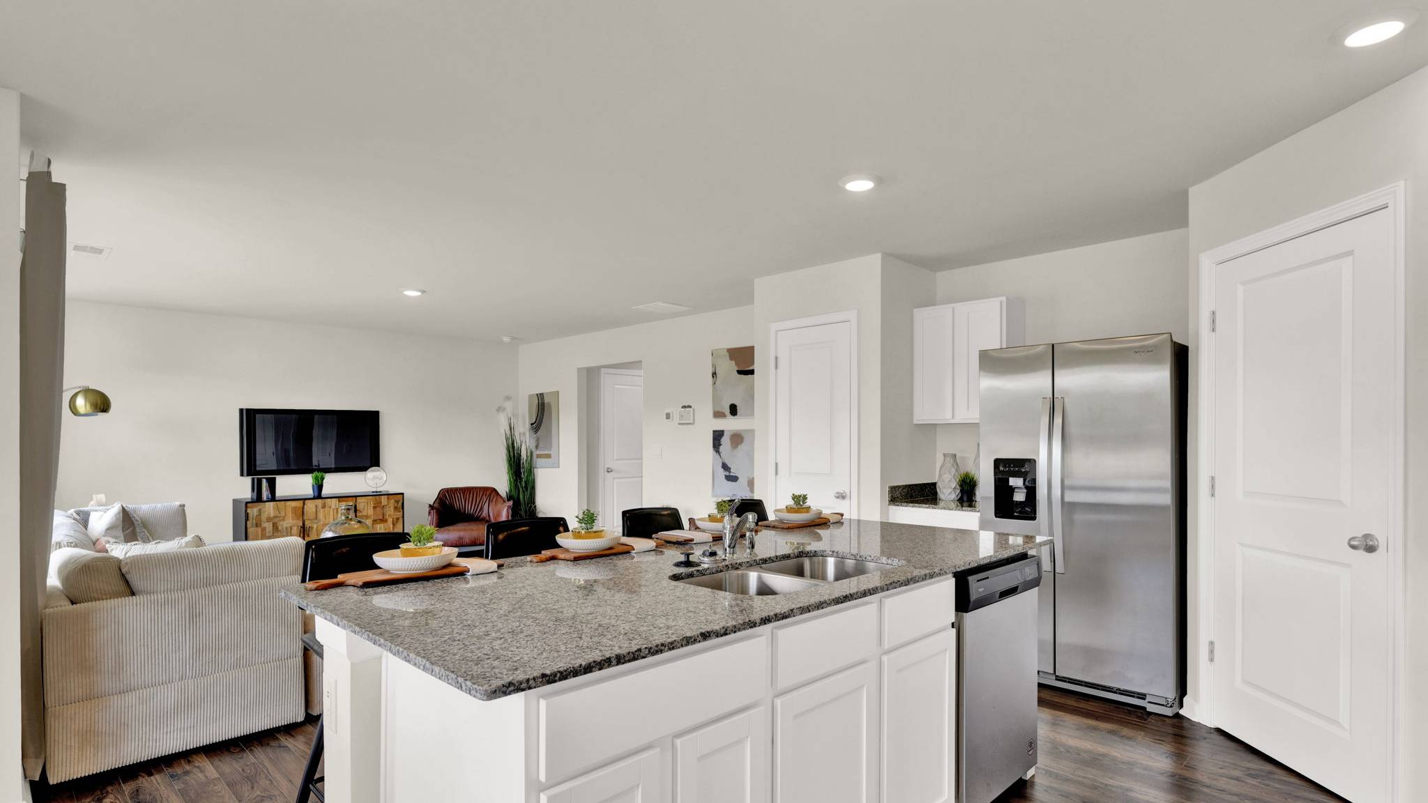 kitchen with island opens into the living area