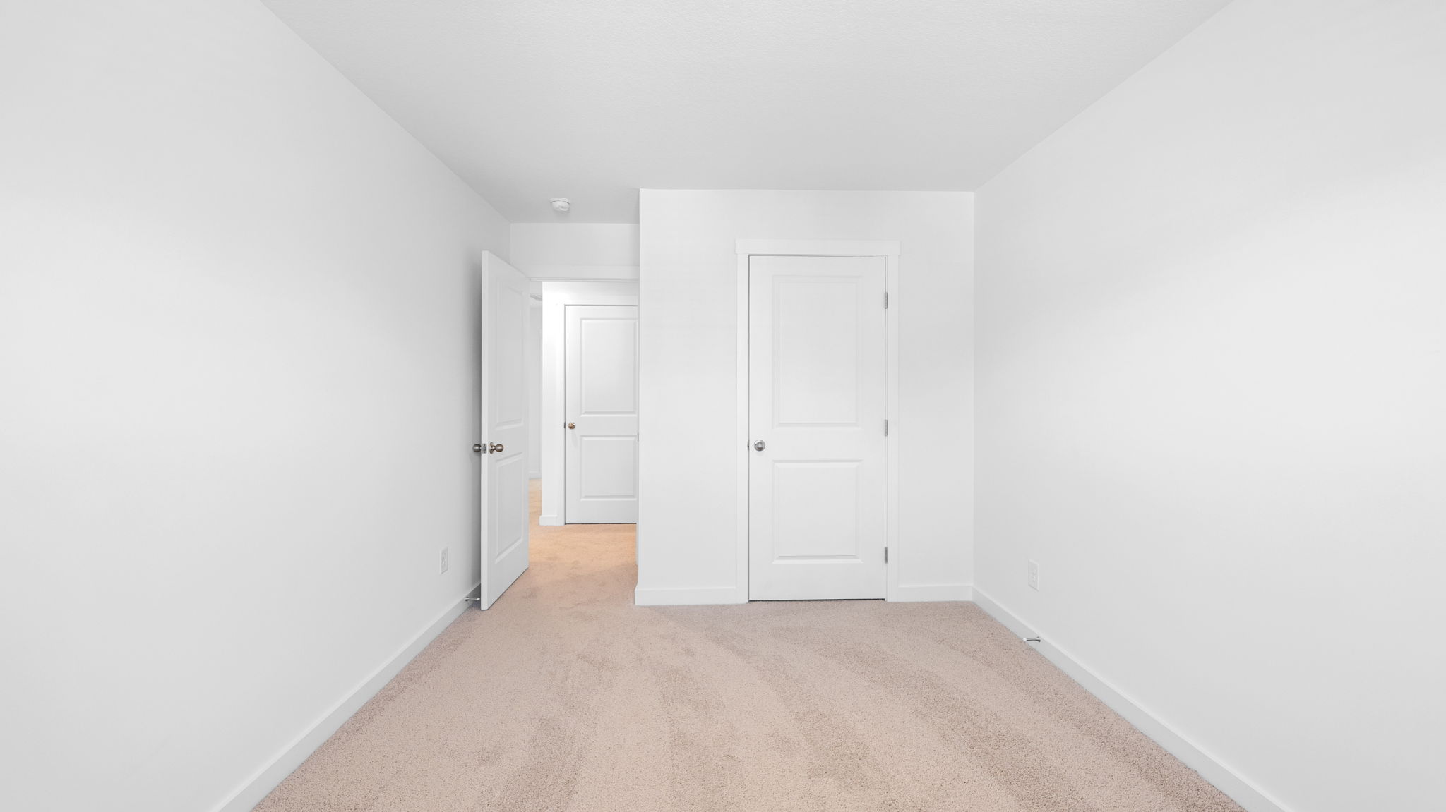 bedroom with single window and walk-in closet