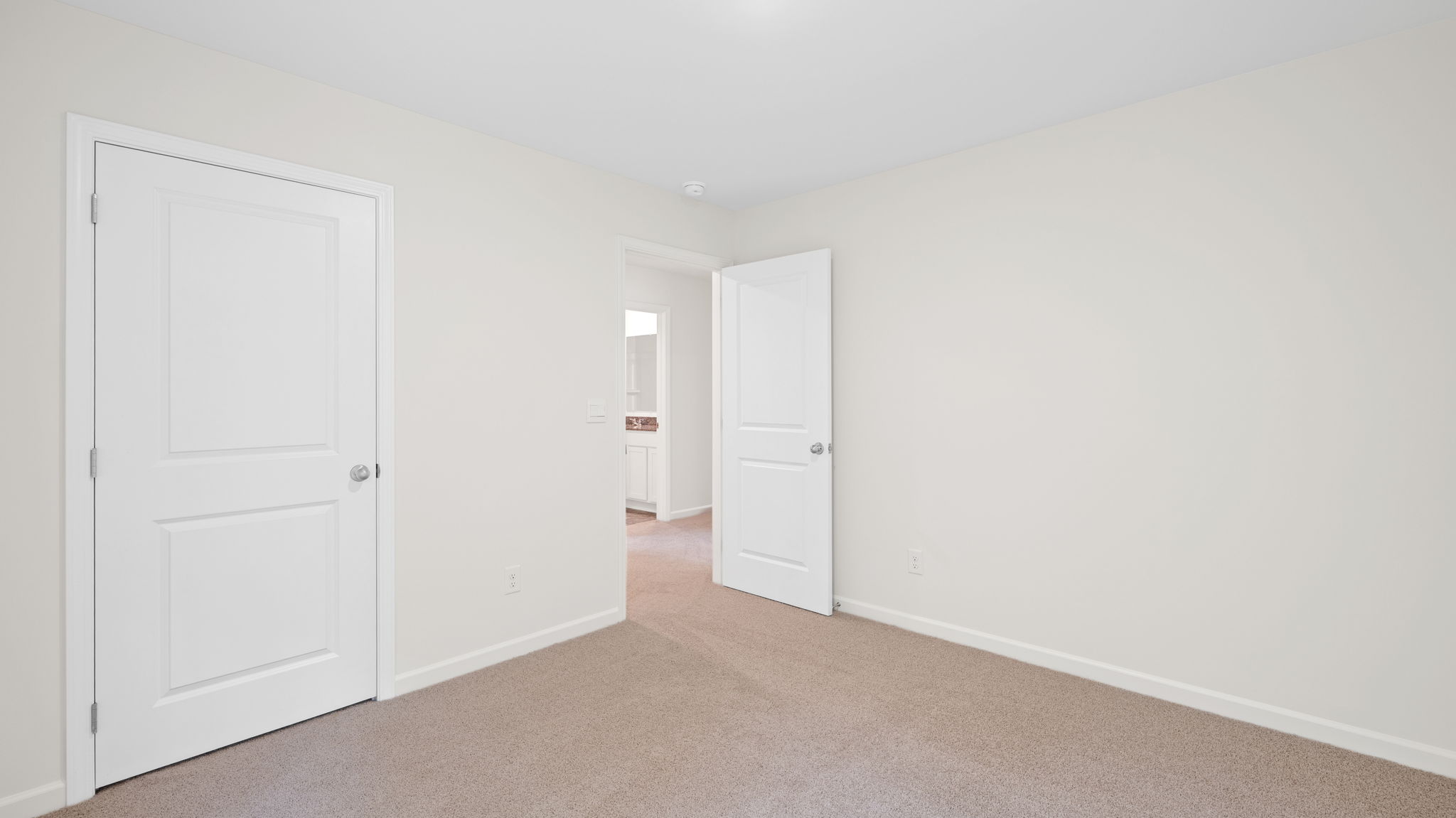 bedroom with single window and walk-in closet