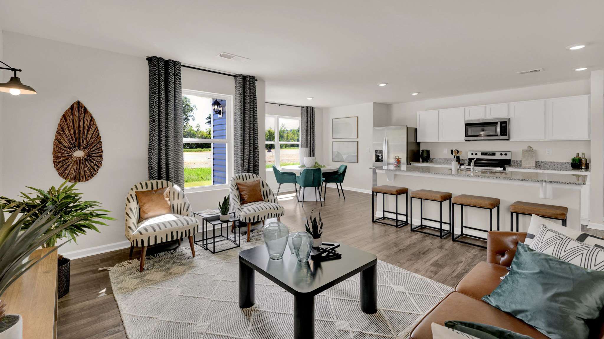 open concept living area with windows