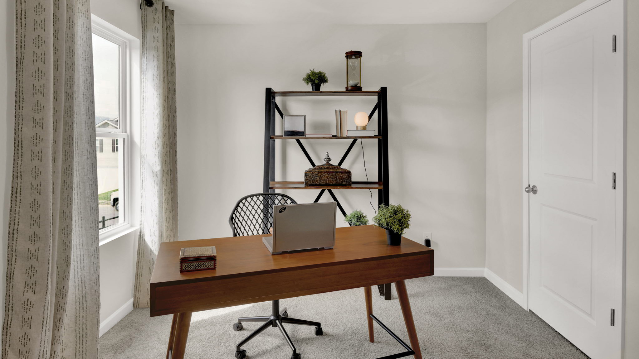 bedroom/ office space with single window and walk-in closet