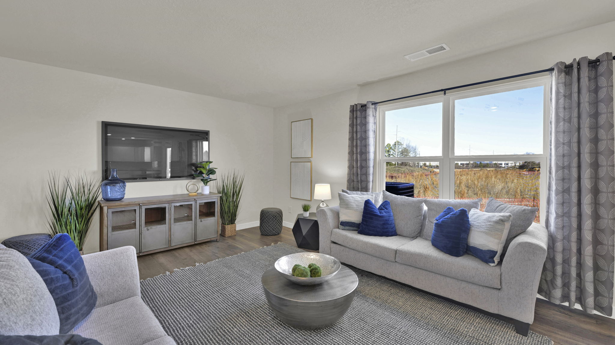 open concept living area with double window