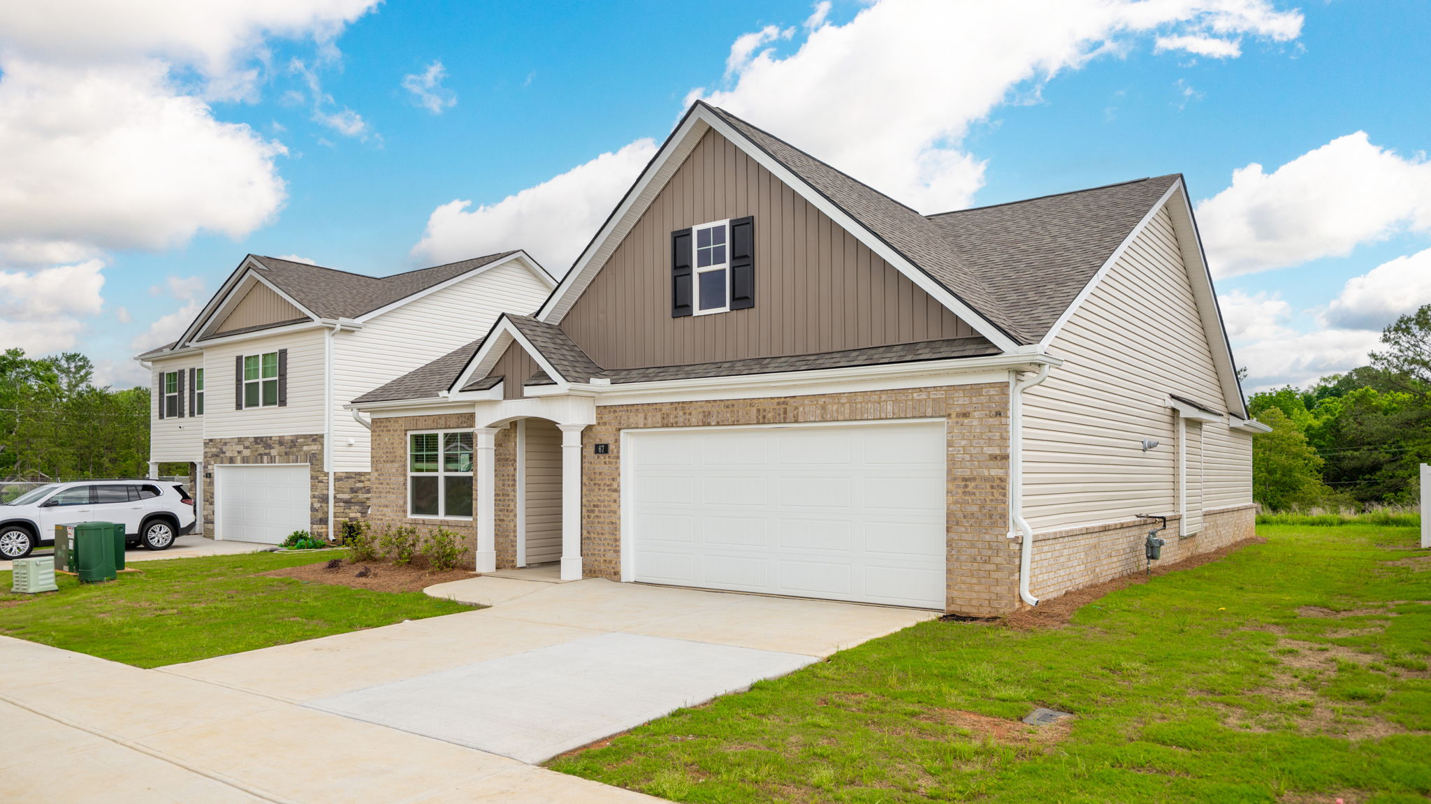 One story home with two car garage and brick